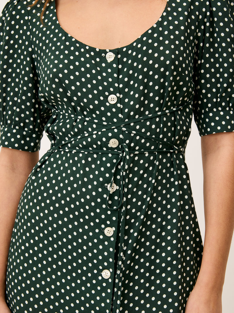 Close-up of the front on the Julia green polka dot dress